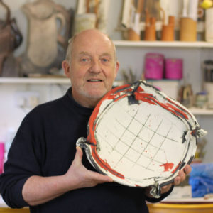 John Higgins holding large bowl